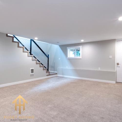 Finished basement with new carpet, stair rail and daylight window